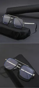 Macro view of black square sunglasses with silver metal double bridge and blue light lenses