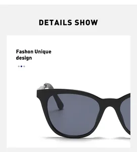 Detailed close-up of durable hinges on oversized black cat-eye sunglasses with dark lenses