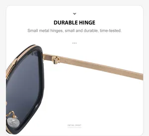 Detail view of durable golden metal hinge and sleek black frame on trendy sunglasses