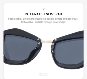 Vue détaillée du support nasal intégré et du pont en métal doré sur les lunettes œil-de-chat