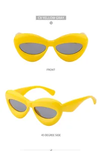 Front and 45-degree side view of bold yellow cat eye sunglasses with gray lenses