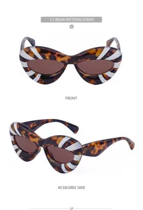 Cat-eye sunglasses in tortoiseshell frame with white radial stripes and dark brown lenses