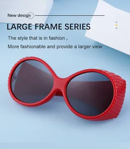 Detail view of bold red oval frame sunglasses with dark lenses and temple specifications