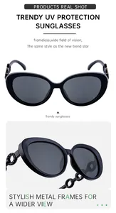 Detail of trendy cat-eye sunglasses with metal frames and intricate cutout side patterns
