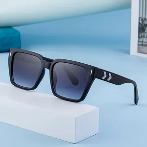 Retro square frame sunglasses with black glossy finish and blue gradient lenses