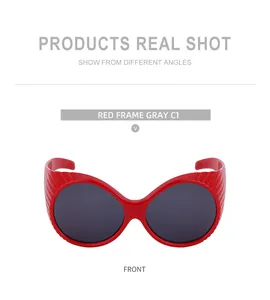 Detailed front view of red oversized oval sunglasses with wavy textured temples and grey lenses