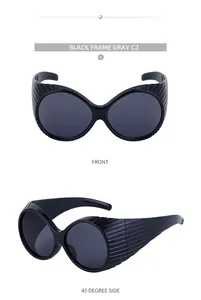 Detailed view of oval large frame sunglasses with vertical striped design and grey lenses