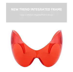 Macro view of the futuristic integrated large V-frame sunglasses in vibrant red