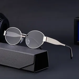 Vintage silver metal frame sunglasses with a black triangular case on a dark background
