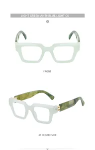 Detalle de gafas cuadradas verde claro anti-luz azul con patillas de textura mármol