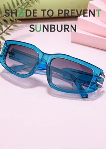 Detail of blue translucent rectangle sunglasses with purple gradient lenses and gold metal accents