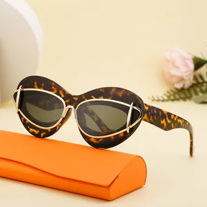 Chic tortoiseshell cat eye sunglasses with gold accents and orange folding case
