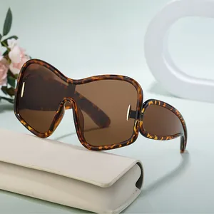 Oversize tortoiseshell butterfly sunglasses with brown lenses and beige glasses case