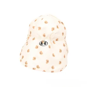 Detail view of baby sun hat with cute brown bear prints and protective neck flap