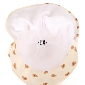 Detailed view of breathable white mesh lining on toddler sun hat with bear patterns