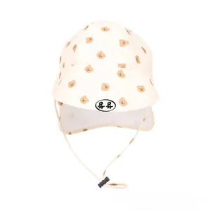 Detail of baby sun hat with bear print, breathable mesh neck flap and adjustable chin strap