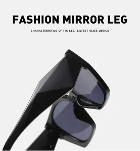 Detail of trendy wide-temple design on black oversized cat-eye sunglasses for women