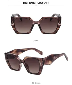Detail view of cat eye sunglasses with brown gravel marble pattern and gradient lenses