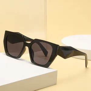 Chic black oversized cat eye sunglasses with thick geometric temples and UV protection