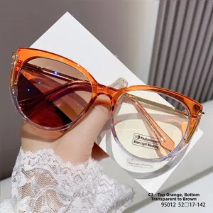 Detail of cat-eye frames with orange gradient, photochromic lenses and gold metal temples