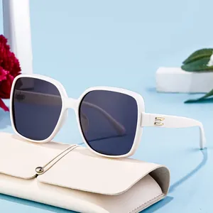 Square polarized sunglasses for women with white frames and gold H-hinge detail