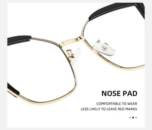 Macro detail of comfortable silicone nose pads and golden metal bridge on cat eye glasses