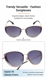 Detail of cat-eye sunglasses featuring purple gradient lenses and gold metal frames