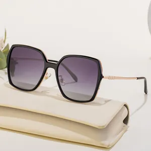 Modern square polarized sunglasses with purple gradient lenses and gold metal temples