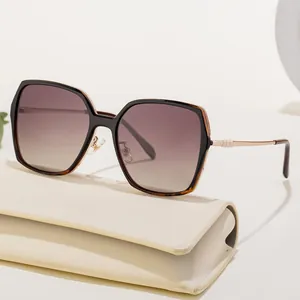 Women's oversized square polarized sunglasses with black frames and gradient purple lenses