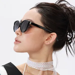 Close-up of black cat-eye polarized sunglasses with gradient lenses and metal side details