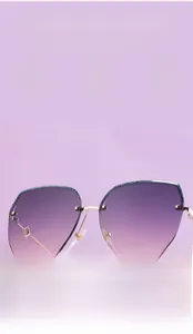 Detail showing gradient purple lenses with UV protection and gold metal half-frame design