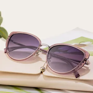 Fashionable cat eye sunglasses with purple gradient lenses and transparent frames