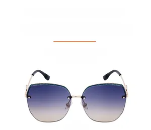 Close-up of square half-frame sunglasses with gradient lenses and sparkling glitter trim
