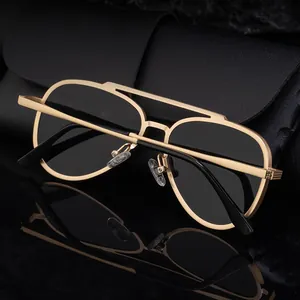 Classic aviator sunglasses with gold metal frame and black lenses on leather case