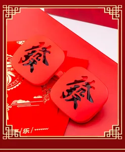 Close-up of red square frame glasses with Chinese 'Xi' character cut-out lens design