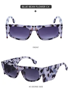 Detailansicht der Cat-Eye-Sonnenbrille mit blauem Marmormuster und breiten Bügeln für Damen