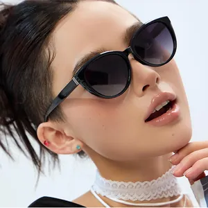 Fashionable cat eye sunglasses with black frames and gradient lenses for women