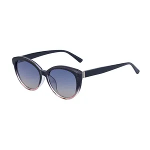Fashion cat-eye polarized sunglasses with gradient gray frame and blue-brown lenses