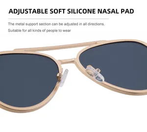 Detail of adjustable soft silicone nose pads on gold metal aviator sunglasses