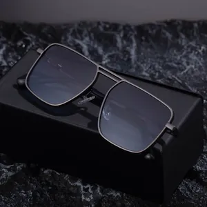 Square metal frame sunglasses for men with dark lenses in a luxury gift box packaging