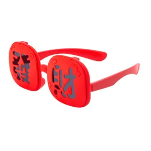 Red festive kids sunglasses with Chinese character cutouts for New Year party celebrations