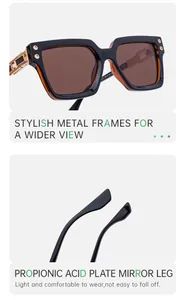 Detail of vintage square black and amber sunglasses with gold metal temples and specs