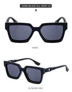 Detail view of sand black square sunglasses with hollow metal temple design and gray lenses