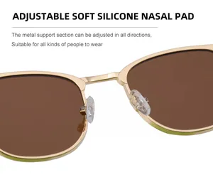 Détail des plaquettes de nez en silicone souple sur monture de lunettes dorée