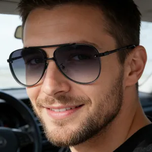 Close-up of men's aviator sunglasses with black metal frame and gradient lenses while driving