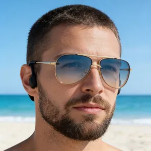 Detail of pilot sunglasses with blue gradient lenses and bone conduction headset on model
