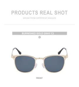 Vue frontale de lunettes de soleil browline dorées avec verres gris foncé et métal