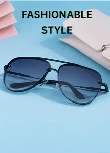 Detail of aviator sunglasses with black metal frame and blue gradient lenses