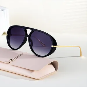 Classic pilot sunglasses with purple gradient lenses and gold metal temples in soft case