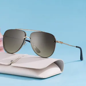 Classic aviator sunglasses with gold metal frame and gradient lenses including leather case